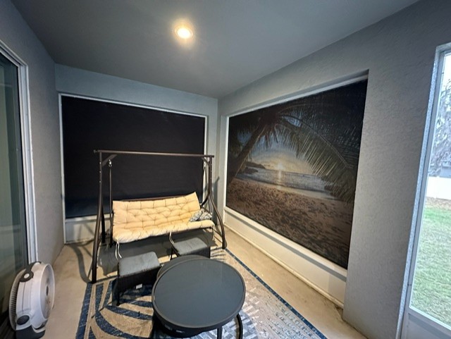 Custom printed island scene autoshade on lanai offering sun protection and complete privacy