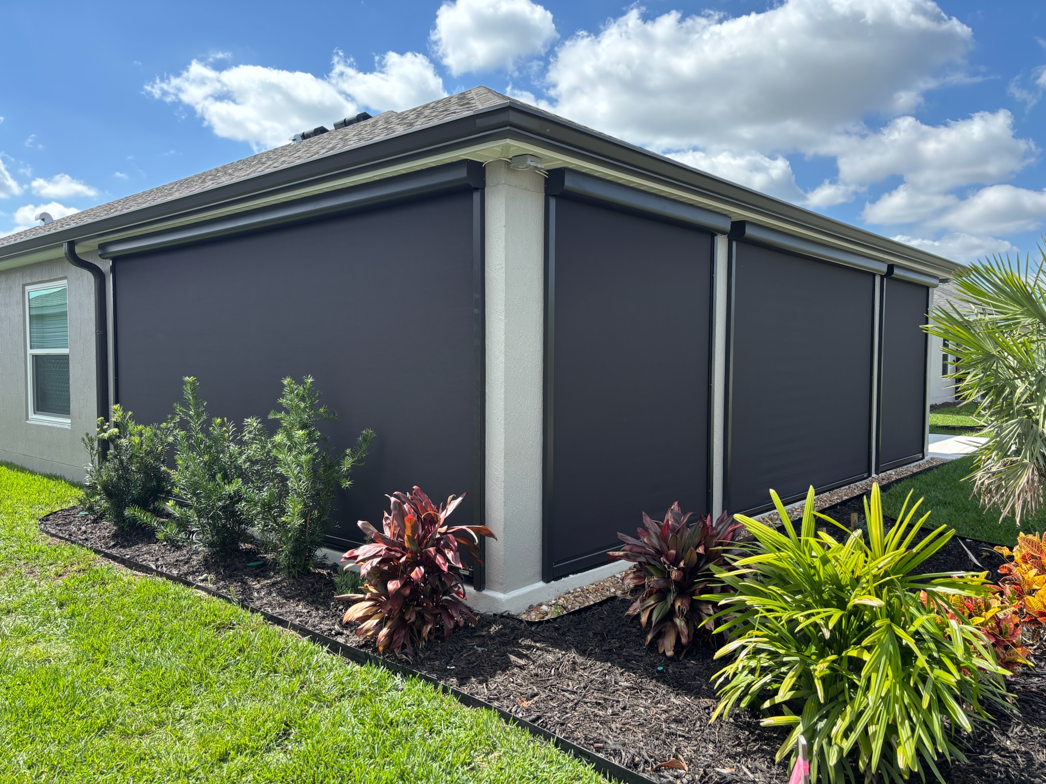Exterior motorized shade for screen lanai to give privacy and weather protection