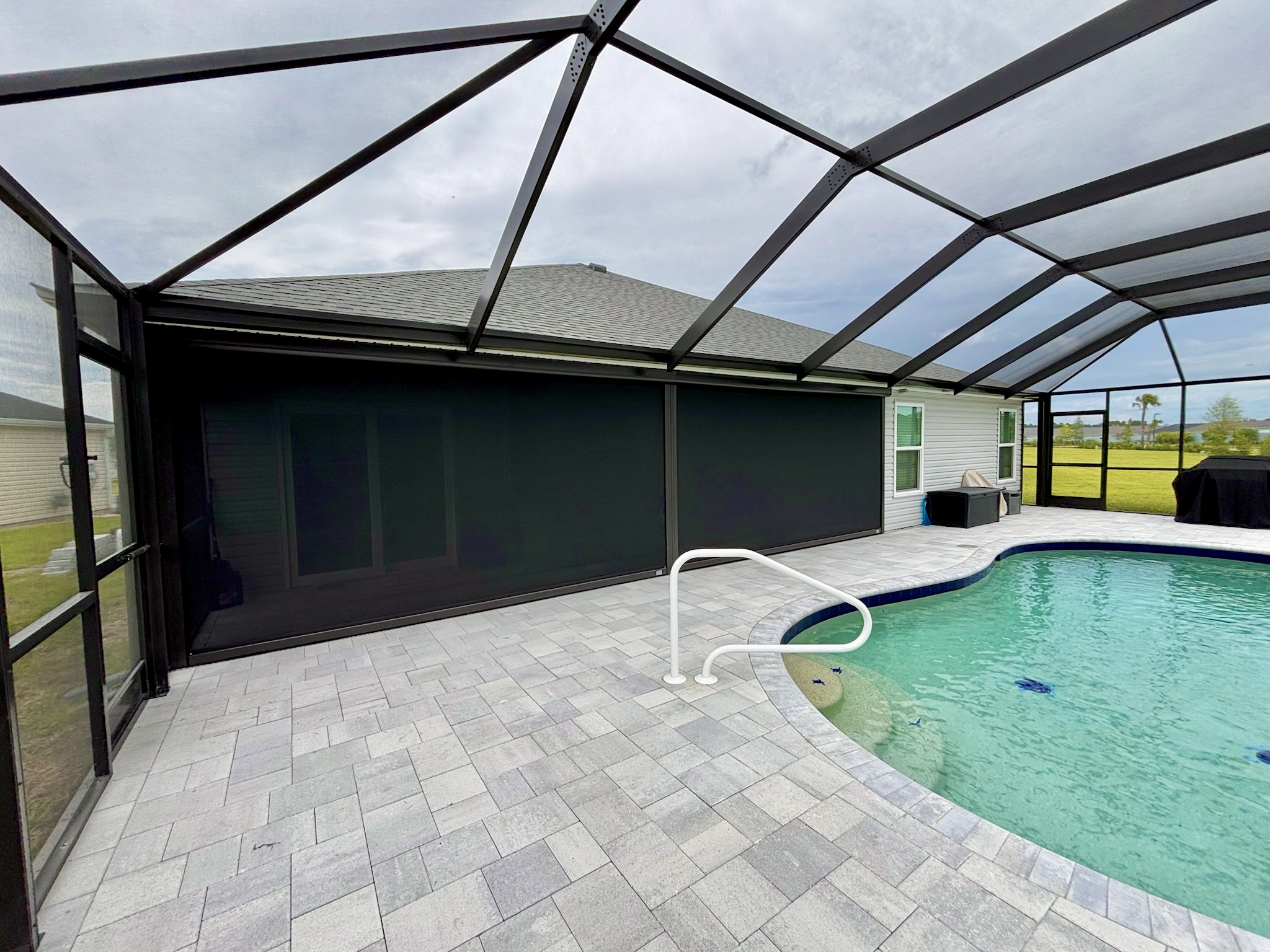 Exterior autoshade motorized on patio lanai enclosed pool birdcage