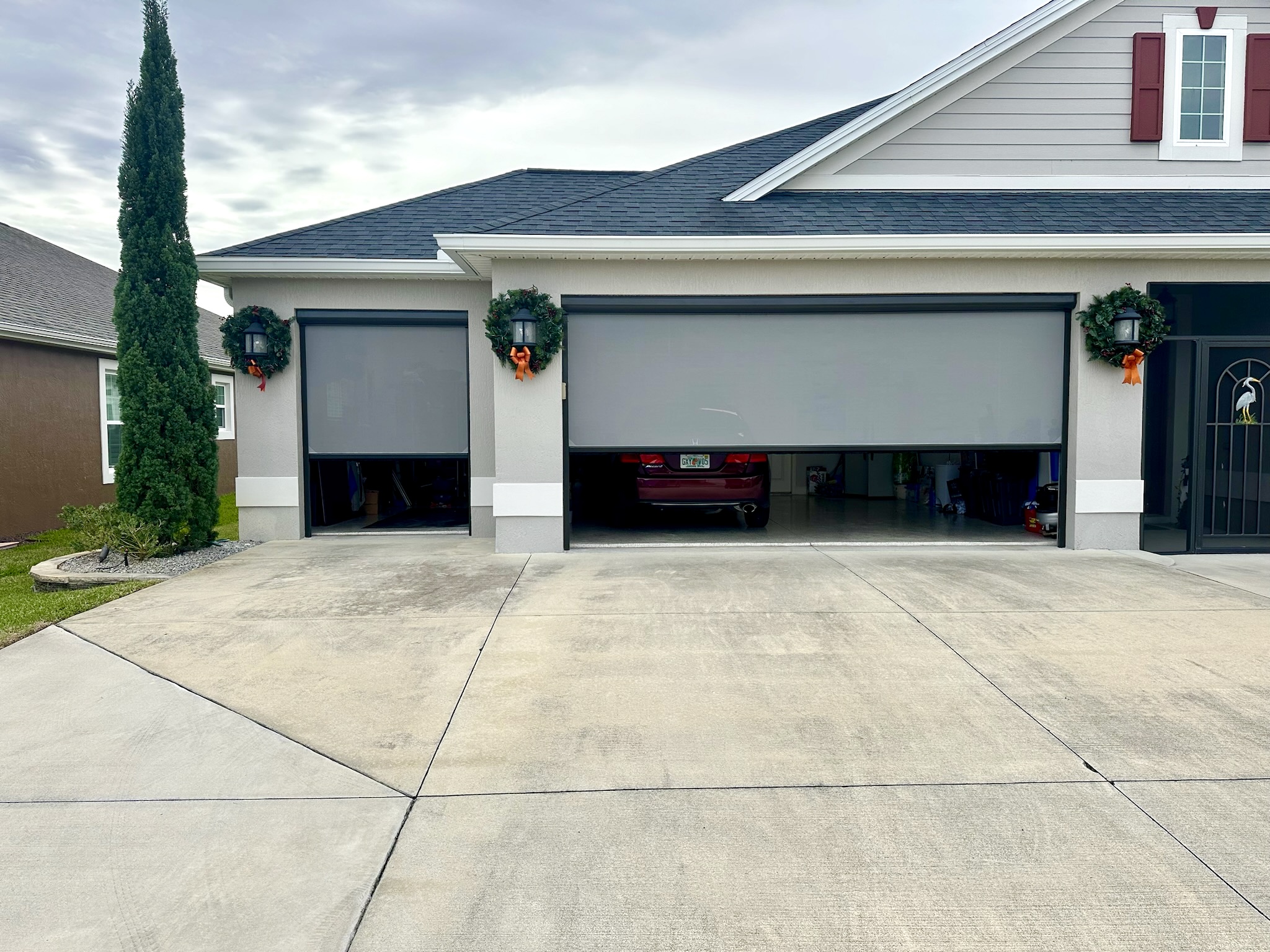 Exterior garage shade for 2 car garage and golf car garage open quarter of the way