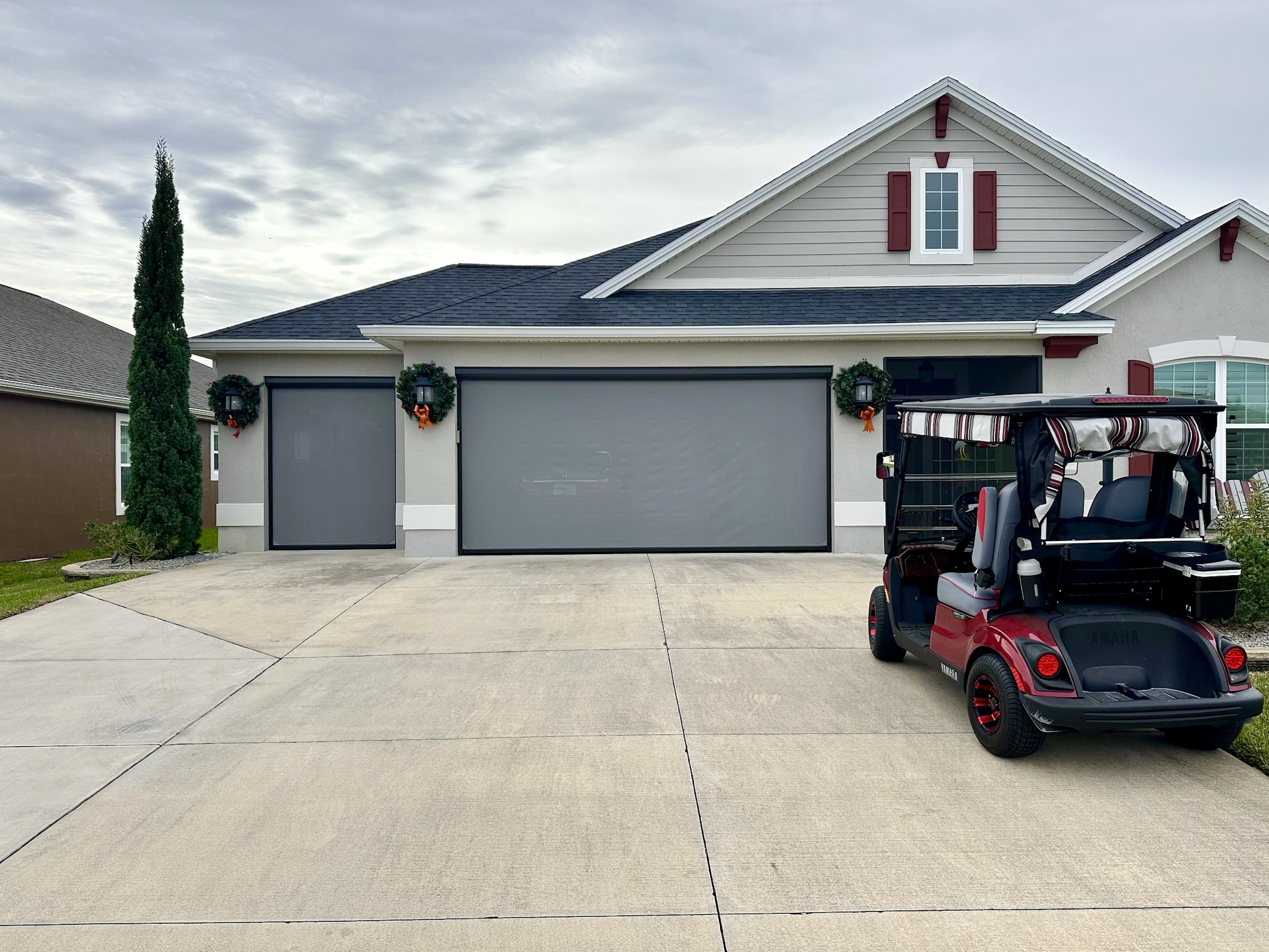 Exterior garage shade for 2 car garage and golf car garage closed for privacy and sun protection