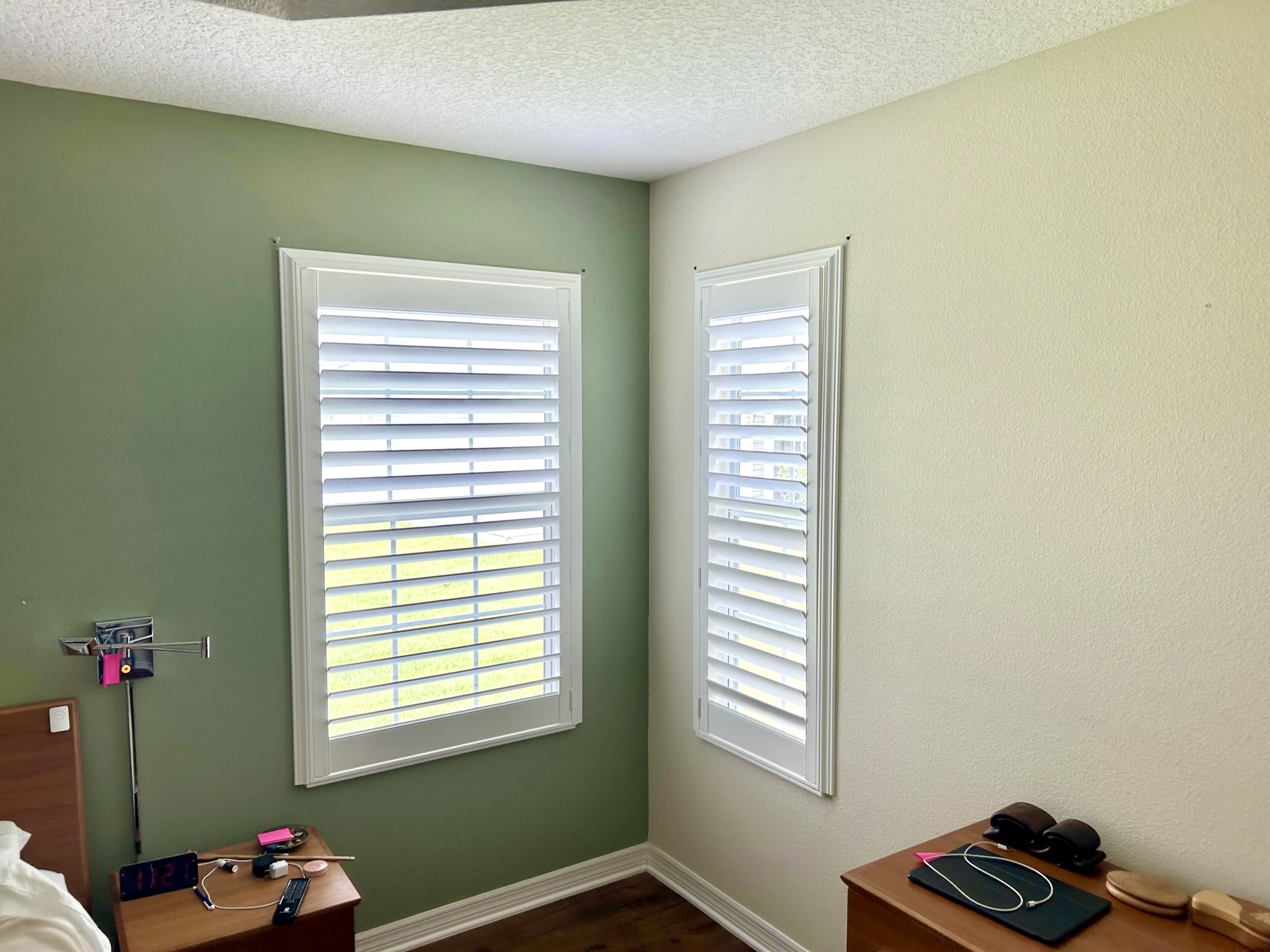 Open plantation shutters in bedroom