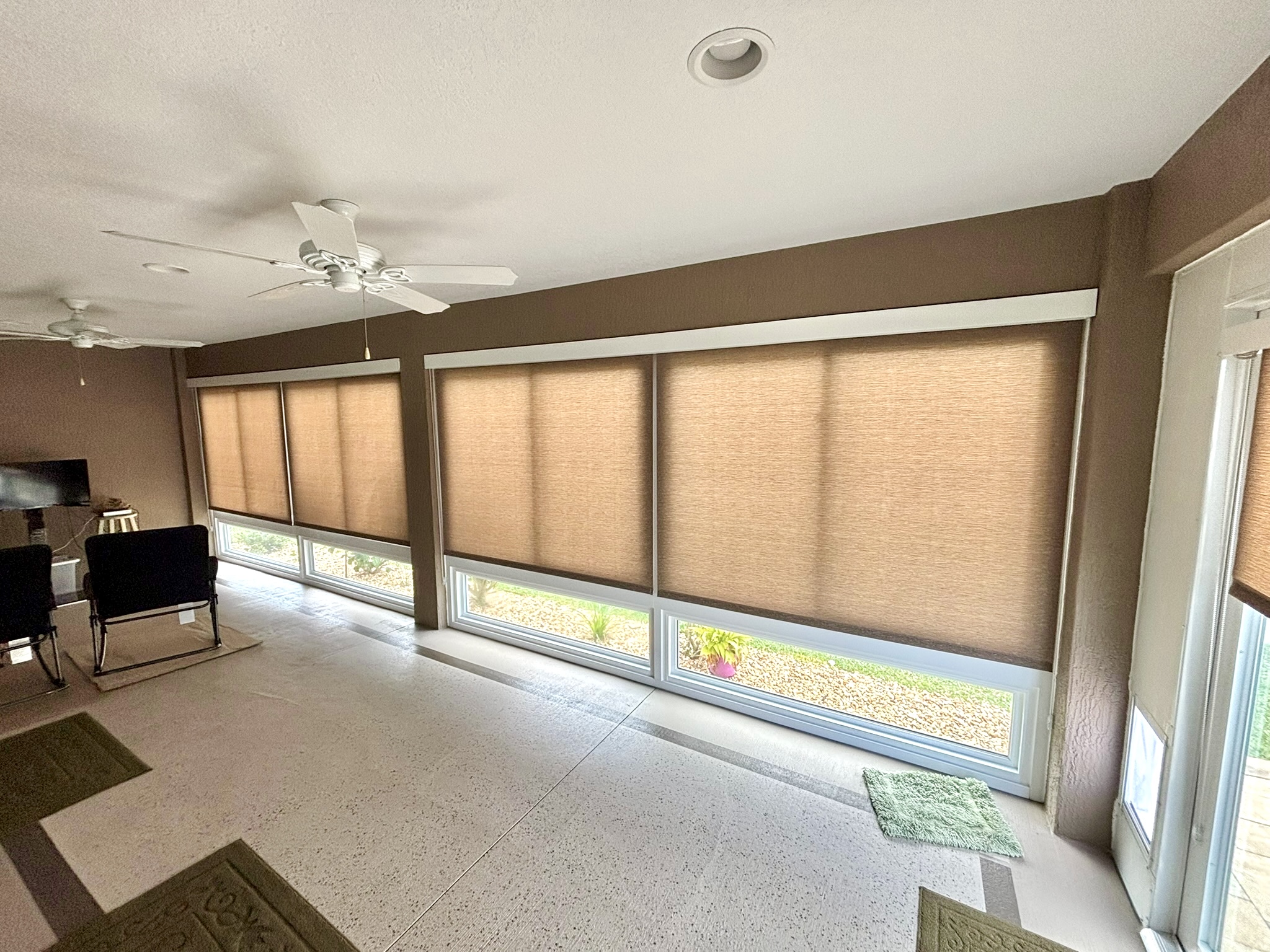 Interior light filtering lanai shades motorized for sun protection and privacy