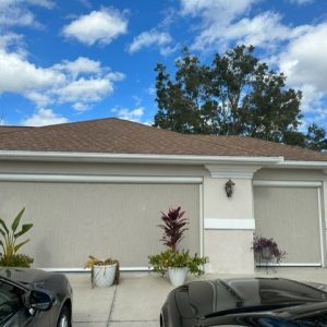 Beige garage door shade on house in The Villages