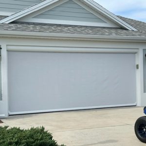 White garage door shade on house in The Villages